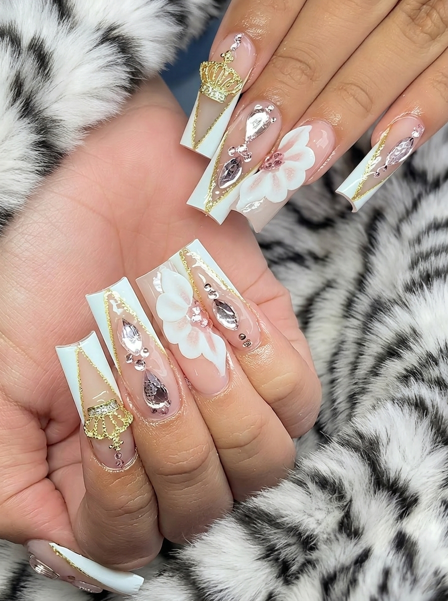White and gold nails with crown and floral 3D art